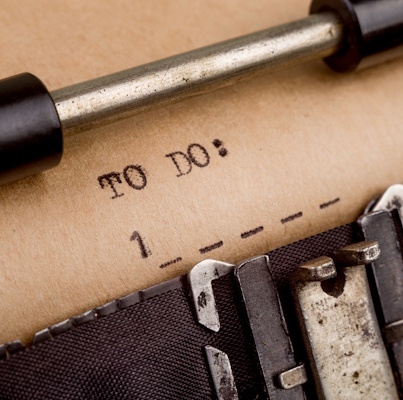 Old-fashioned manual typewriter with paper showing typed text saying 'To Do:'